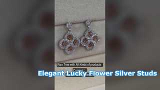 Pendientes elegantes con circonita cúbica de plata 925 y flor de la suerte