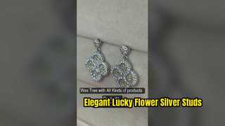 Elegantes pendientes de tuerca de plata con flor de la suerte, color verde manzana, circonita azul