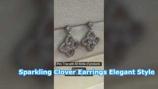 Pendientes de plata de ley brillante con circonita cúbica y trébol de cuatro hojas, color champán